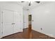 Empty bedroom featuring hardwood floors and a closet at 8406 Flint Hill Dr, Charlotte, NC 28273