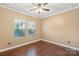 Empty bedroom with hardwood floors, natural light, and neutral paint at 8406 Flint Hill Dr, Charlotte, NC 28273