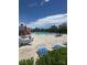 Community pool with abundant seating, shade and blue skies at 8406 Flint Hill Dr, Charlotte, NC 28273