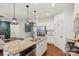 Modern kitchen featuring a granite island, stainless steel appliances, and an open layout at 8406 Flint Hill Dr, Charlotte, NC 28273