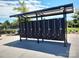 Community mailboxes in a covered structure next to pool providing secure mail access for residents at 8406 Flint Hill Dr, Charlotte, NC 28273
