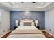 Comfortable main bedroom with a decorative accent wall, trey ceiling, and ample natural light at 8406 Flint Hill Dr, Charlotte, NC 28273