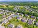 Neighborhood aerial view showcases mature trees, sidewalks, and proximity to green spaces at 8493 Twickenham Ter, Harrisburg, NC 28075