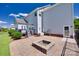 Outdoor patio with a charming fire pit, offering a cozy space for gatherings and relaxation at 8493 Twickenham Ter, Harrisburg, NC 28075
