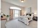 Serene bedroom with a large window, soft carpet, and elegant decor at 8493 Twickenham Ter, Harrisburg, NC 28075