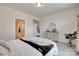 Comfortable bedroom showcasing plush bedding and ample natural light at 8493 Twickenham Ter, Harrisburg, NC 28075