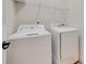Well-equipped laundry room with a modern washer and dryer, providing convenience and functionality at 8493 Twickenham Ter, Harrisburg, NC 28075