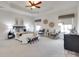Spacious main bedroom with tray ceiling, plush carpeting, and decorative details at 8493 Twickenham Ter, Harrisburg, NC 28075