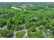 Aerial view of the property, showcasing its location surrounded by lush greenery and neighborhood at 8938 Glencroft Rd, Mint Hill, NC 28227