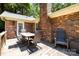Back deck with furniture, and brick chimney at 8938 Glencroft Rd, Mint Hill, NC 28227