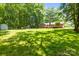 Spacious backyard featuring a shed and a playground, perfect for outdoor activities at 8938 Glencroft Rd, Mint Hill, NC 28227