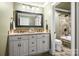 Bathroom featuring double vanity, granite countertop, tile floor and walk in shower at 8938 Glencroft Rd, Mint Hill, NC 28227