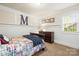Bedroom features neutral paint, carpeted floors, and a comfortable bed with plaid bedding at 8938 Glencroft Rd, Mint Hill, NC 28227