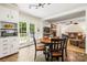 Eat-in kitchen area offering views of the living room and access to a deck at 8938 Glencroft Rd, Mint Hill, NC 28227