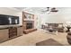 Inviting living room featuring a brick fireplace, ceiling fan, and comfortable seating arrangement at 8938 Glencroft Rd, Mint Hill, NC 28227