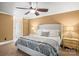 Comfortable main bedroom featuring a ceiling fan, two side tables, and natural light at 8938 Glencroft Rd, Mint Hill, NC 28227