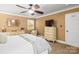 Comfortable main bedroom featuring a ceiling fan, dresser, and natural light at 8938 Glencroft Rd, Mint Hill, NC 28227