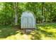A backyard shed offers extra storage in this beautiful outdoor space at 8938 Glencroft Rd, Mint Hill, NC 28227