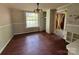 A dining room with a window, light fixture, and open doorway has an area for entertaining guests at 9401 Gold Hill Rd, Mount Pleasant, NC 28124
