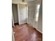 A home entryway with wood floors features a closet space, lighting and access to the main house at 9401 Gold Hill Rd, Mount Pleasant, NC 28124