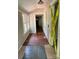 The hallway features hardwood and tile floors, with natural light from a window at 9401 Gold Hill Rd, Mount Pleasant, NC 28124