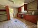 The kitchen features lots of cabinets, a window for natural light, and tile flooring at 9401 Gold Hill Rd, Mount Pleasant, NC 28124