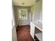 The laundry room with a view of the backyard features a window, counter space and storage at 9401 Gold Hill Rd, Mount Pleasant, NC 28124
