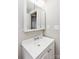 Cozy bathroom featuring a bright white vanity, mirrored medicine cabinet, and ample lighting at 9464 Lexington Cir # B, Charlotte, NC 28213
