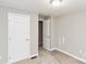 A bedroom shows an entrance way and door at 9464 Lexington Cir # B, Charlotte, NC 28213