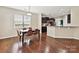 Bright breakfast area is located adjacent to the kitchen and features hardwood floors and natural light at 9507 Reid Hall Ln, Matthews, NC 28105