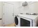 Bright laundry room features updated washer and dryer with a storage shelf for maximum convenience at 9507 Reid Hall Ln, Matthews, NC 28105