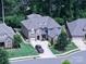 Stunning aerial view of a two-story home with a manicured lawn, mature trees, and a paved driveway at 1006 Wellington Ave, Indian Land, SC 29707