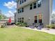 Backyard featuring a lawn, lounge chairs, patio and flower garden at 1006 Wellington Ave, Indian Land, SC 29707