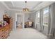 Bedroom with a desk, pendant light and multiple windows for ample natural light at 1006 Wellington Ave, Indian Land, SC 29707