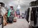 Spacious walk-in closet with ample storage, hanging racks, and a stylish chandelier at 1006 Wellington Ave, Indian Land, SC 29707