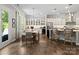 Bright and airy kitchen with white cabinets, stainless steel appliances, and a breakfast bar at 1006 Wellington Ave, Indian Land, SC 29707