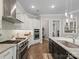 Well-equipped kitchen with stainless steel appliances, granite countertops, and white cabinetry at 1006 Wellington Ave, Indian Land, SC 29707