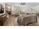 Cozy living room with a stone fireplace, comfortable seating, and a ceiling fan at 1006 Wellington Ave, Indian Land, SC 29707