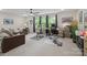 Bright living space with a neutral palette, dual work areas, and a comfortable sectional sofa at 1006 Wellington Ave, Indian Land, SC 29707