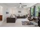 Spacious living room features a large sectional sofa, ceiling fan, and plenty of natural light at 1006 Wellington Ave, Indian Land, SC 29707