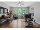 Office space with wood floors, ceiling fan, wallpaper accent and three large windows at 1006 Wellington Ave, Indian Land, SC 29707