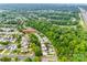 Scenic aerial view showcases the home's location within a lush, tree-lined neighborhood near a highway at 10407 Alvarado Way, Charlotte, NC 28277
