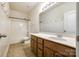 A full bathroom with a shower and tub combo plus vanity at 10407 Alvarado Way, Charlotte, NC 28277