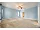 Large bedroom with carpet and a ceiling fan at 10407 Alvarado Way, Charlotte, NC 28277