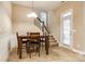 Dining room featuring a wood table set, staircase, and door to the outside at 10407 Alvarado Way, Charlotte, NC 28277