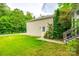 Detached garage with side door and walkway at 10407 Alvarado Way, Charlotte, NC 28277