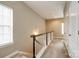 Upstairs hallway with carpet and natural light at 10407 Alvarado Way, Charlotte, NC 28277