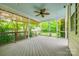 Relaxing screened porch with ceiling fan and wooded views at 10407 Alvarado Way, Charlotte, NC 28277