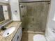 Elegant bathroom boasting granite countertops and a glass-enclosed shower with decorative tile at 10518 Fairway Ridge Rd, Charlotte, NC 28277