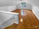 Bright bonus room with hardwood floors, natural light, and staircase access at 10518 Fairway Ridge Rd, Charlotte, NC 28277